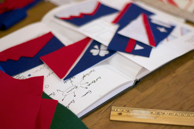 Many red, white and blue felt flag designs